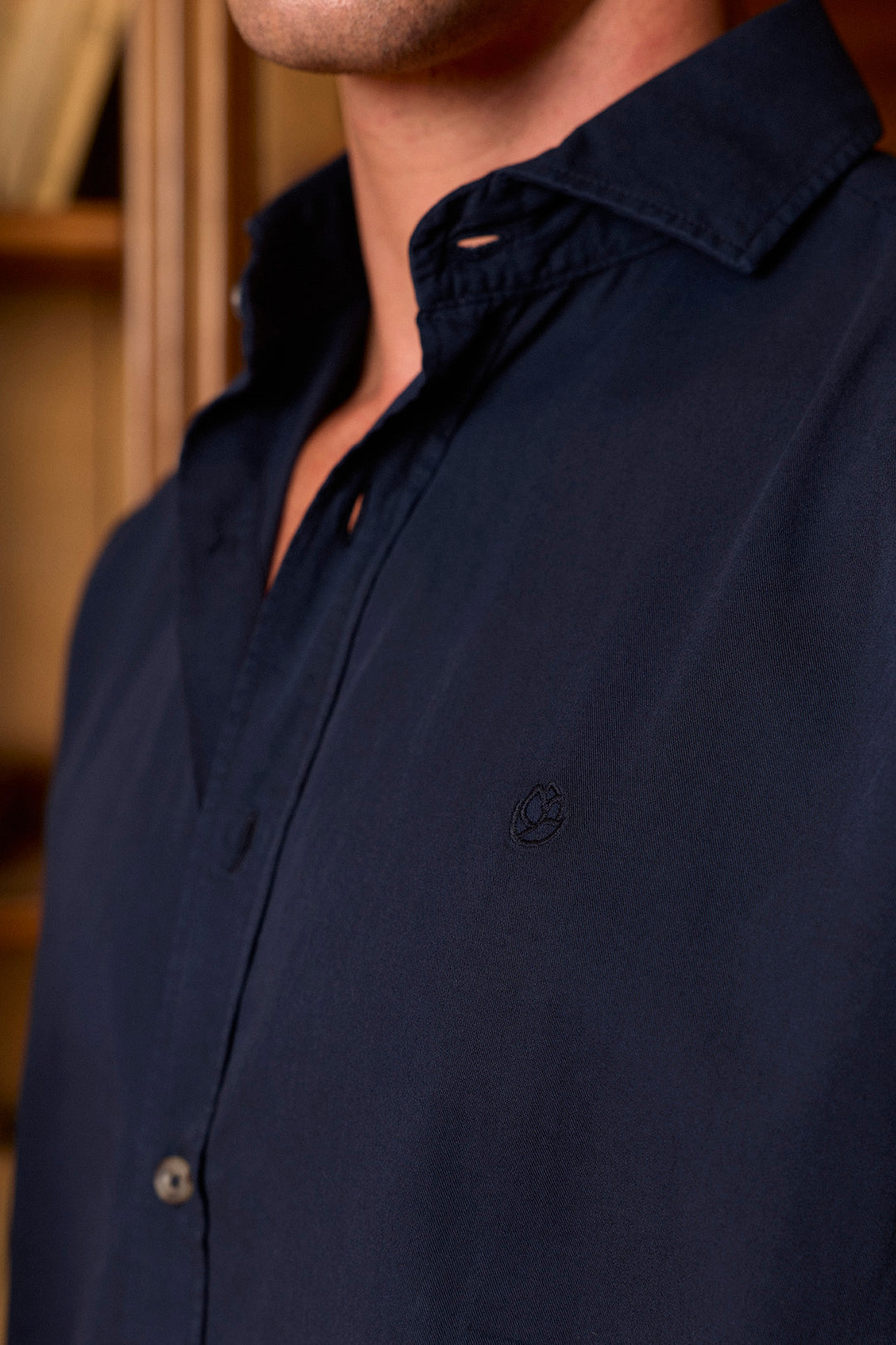 Navy-blue cotton twill shirt with worn button-down buttons