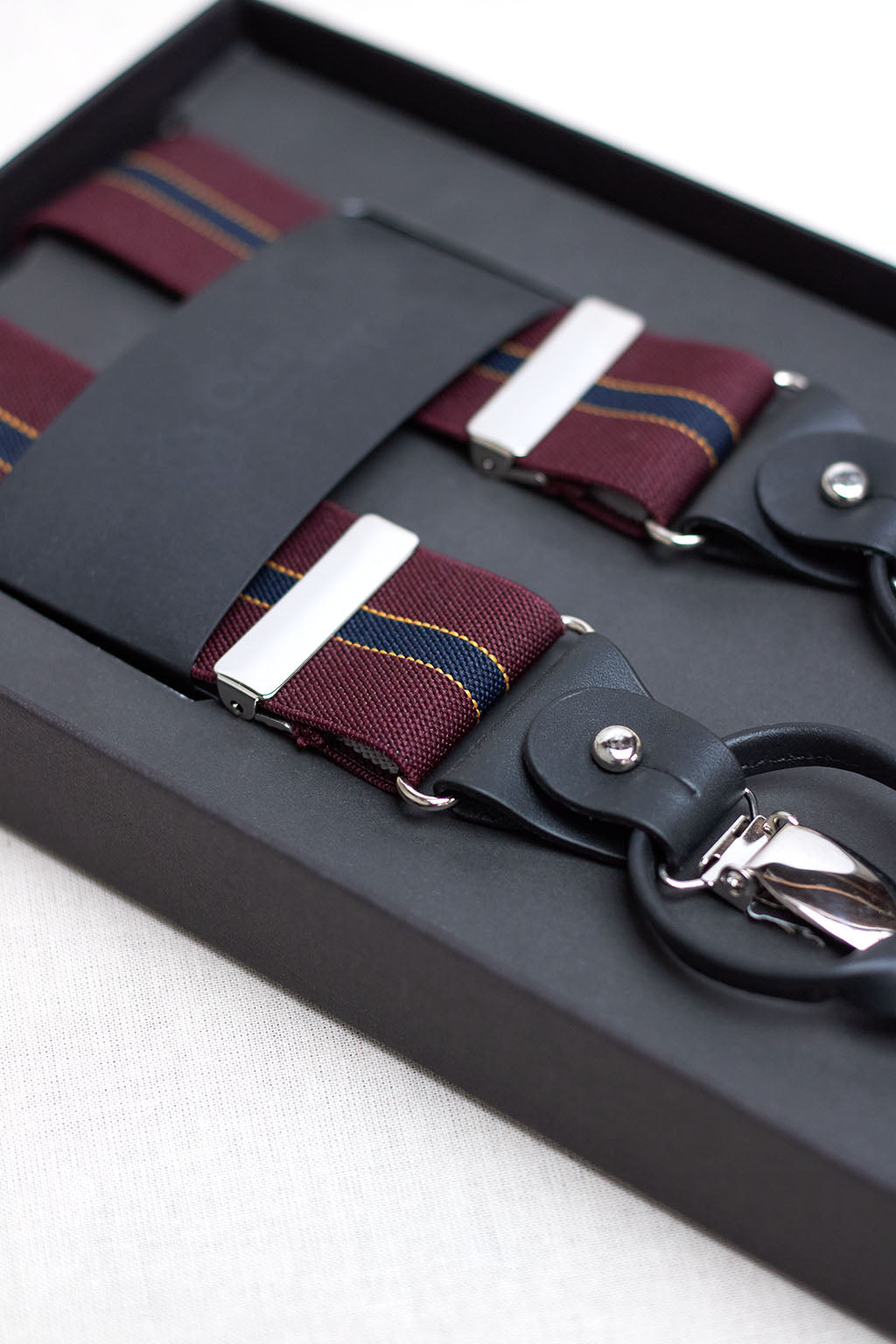 Burgundy Suspenders with Vertical Blue Stripe Outlined in Yellow and Brown Leather Handles